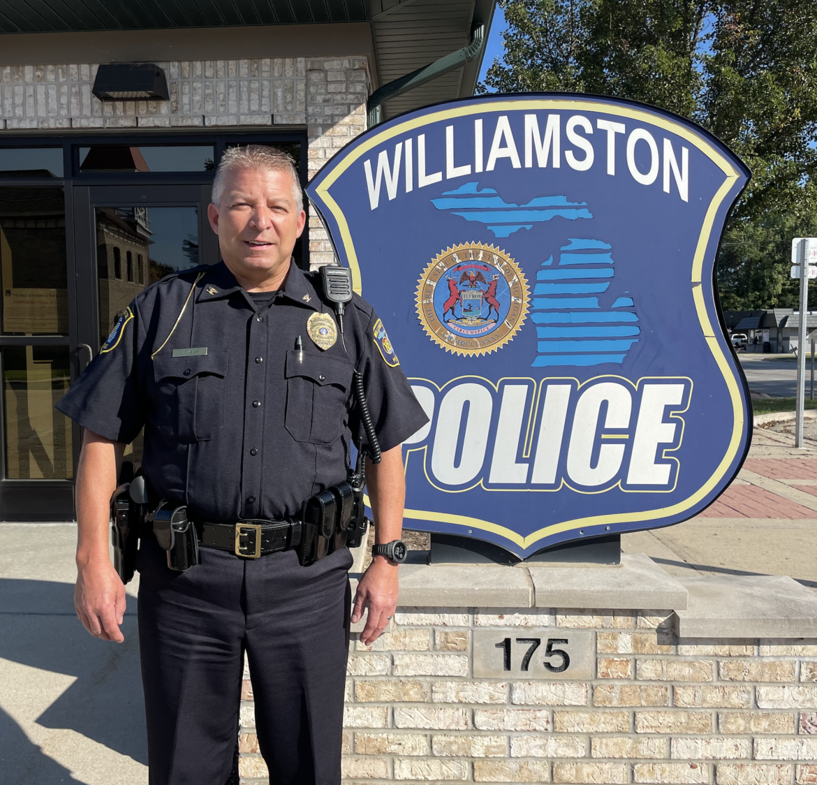 Jeff Weiss, Williamston's new Chief of Police standing in front of the Williamston Police Department
